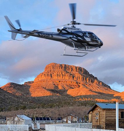 Helicopter landing at Grand Canyon Western Ranch below Spirit Mountain